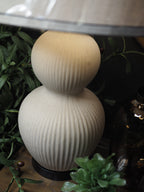 Ivory ceramic lamp with oatmeal and black trim shade