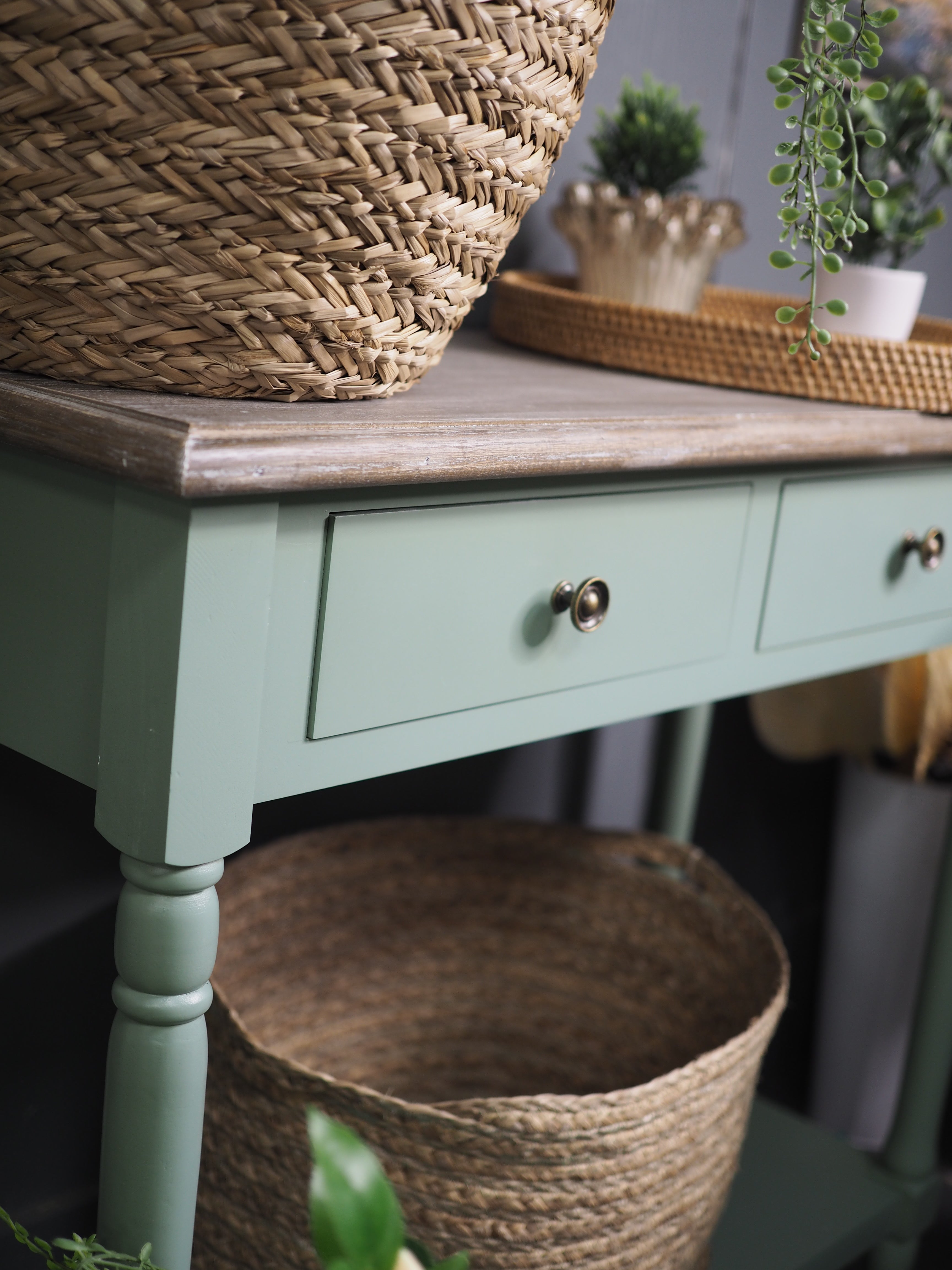 Two drawer green console table with shelf