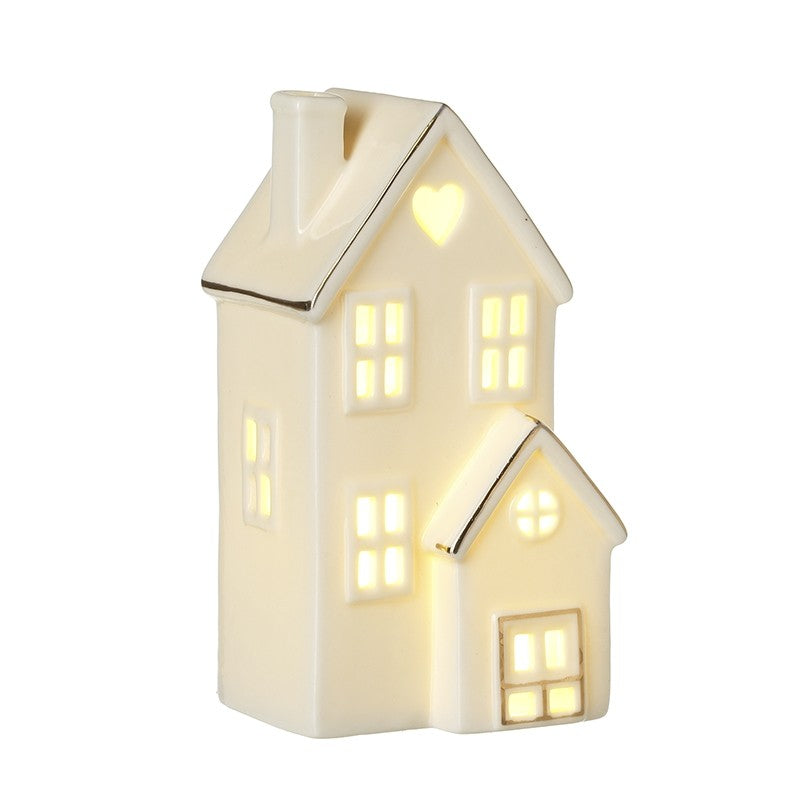 Cute cream light up house with gold edge