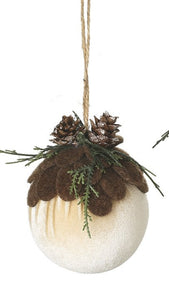 Two decorative ornaments with pinecones and greenery on a white background