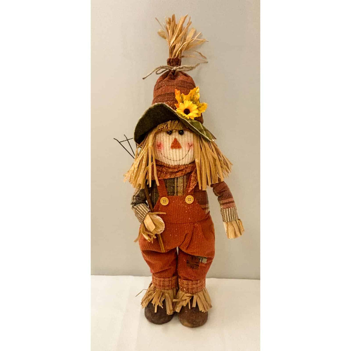 Small scarecrow standing figure