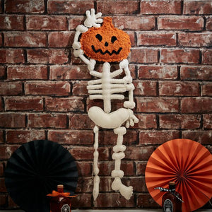 Skeleton with pumpkin head hanging dec