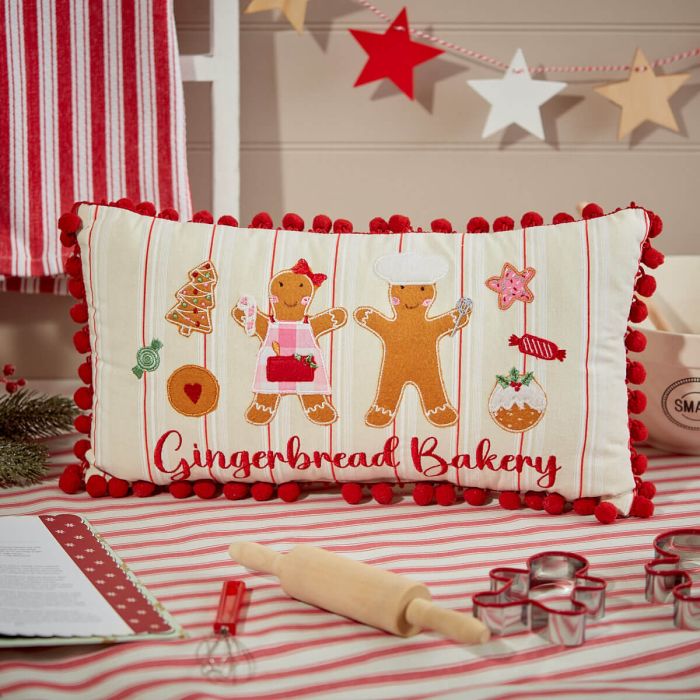 Pompom lined Gingerbread bakery cushion