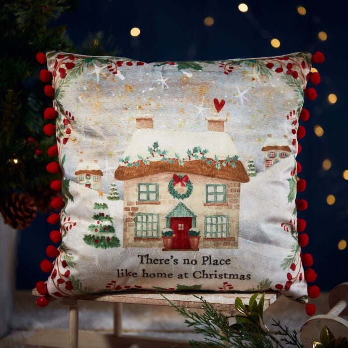 Christmas cottage cushion with red pom pom trim