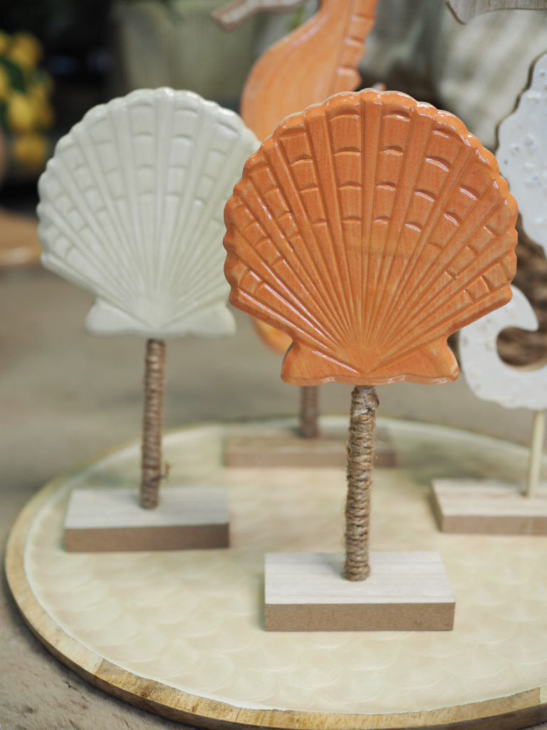 Wooden shell ornament with enamel finish