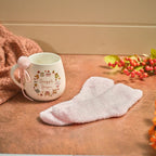 Cozy chapter snuggle season mug with fluffy socks