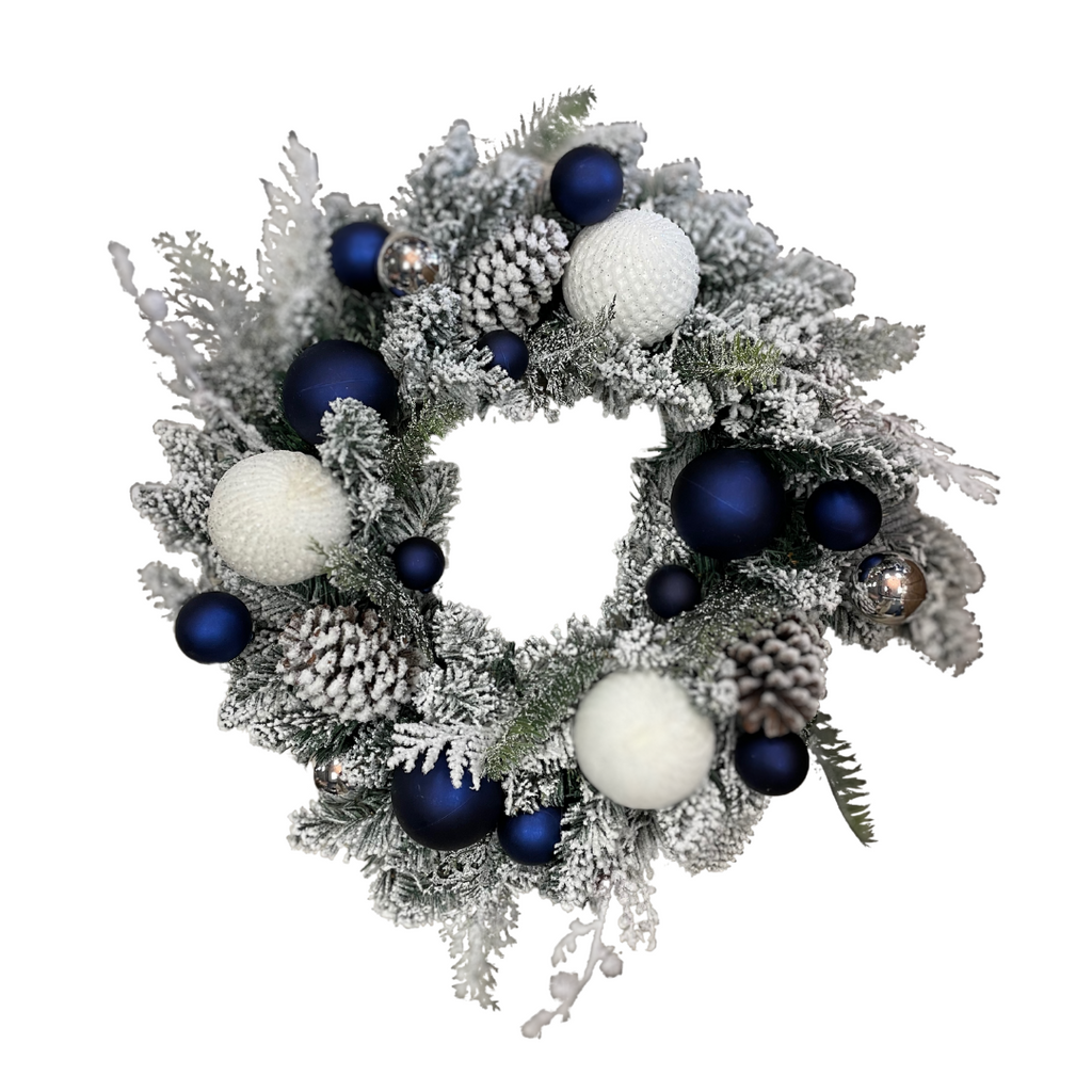 Flocked pinecone wreath with midnight blue and white baubles