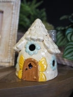 LED stoneware house with butterfly door and floral window