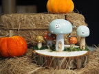 Wooden toadstool houses on log