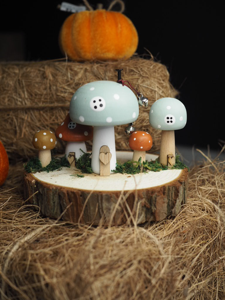 Wooden toadstool houses on log
