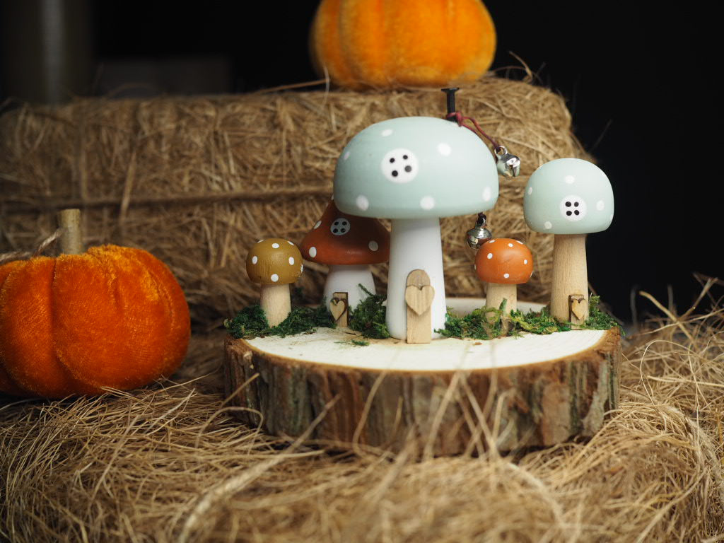 Wooden toadstool houses on log