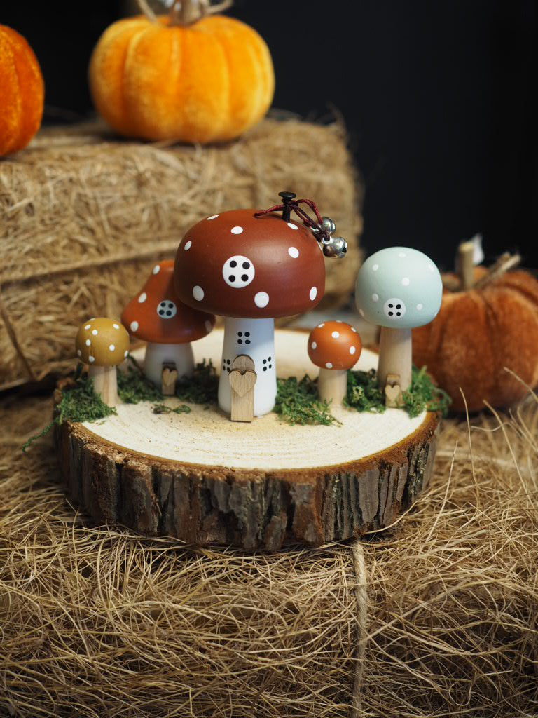 Wooden toadstool houses on log