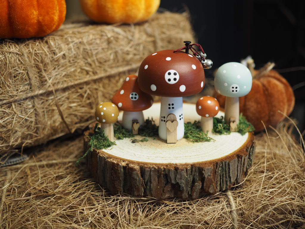 Wooden toadstool houses on log