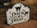 White trick or treat metal sign