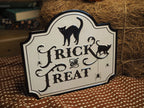 White trick or treat metal sign