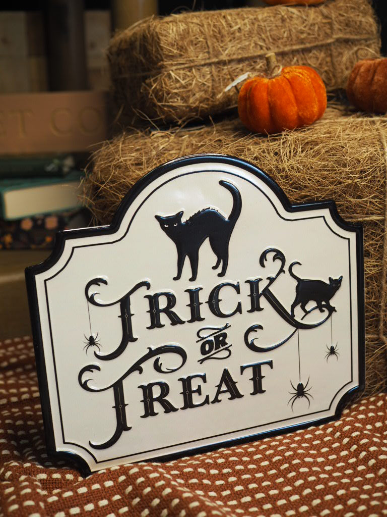 White trick or treat metal sign