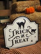 White trick or treat metal sign