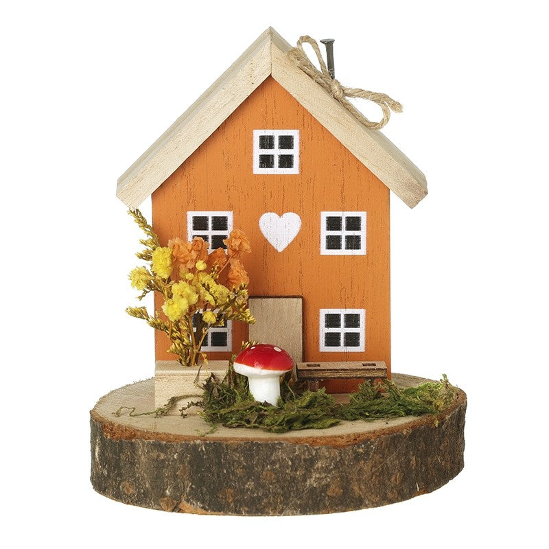 Autumnal wooden house with toadstool ornament