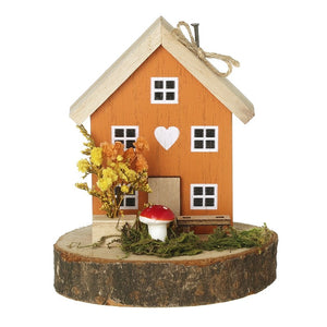 Autumnal wooden house with toadstool ornament