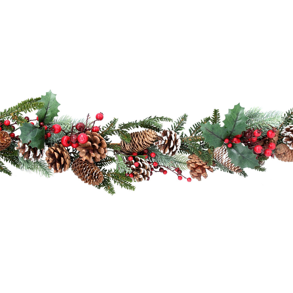 Fir garland with snowy cones and red berries