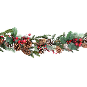 Fir garland with snowy cones and red berries