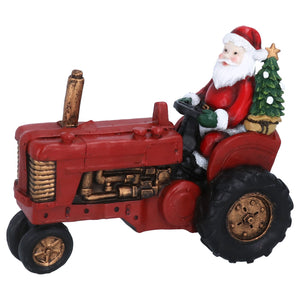 Santa on a vintage red tractor ornament