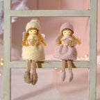 Festive girls in bobble hats shelf sitter