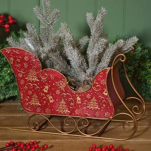 Metal sleigh with embossed Christmas trees and bells