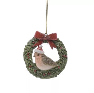 Traditional Christmas robin in a wreath hanging dec