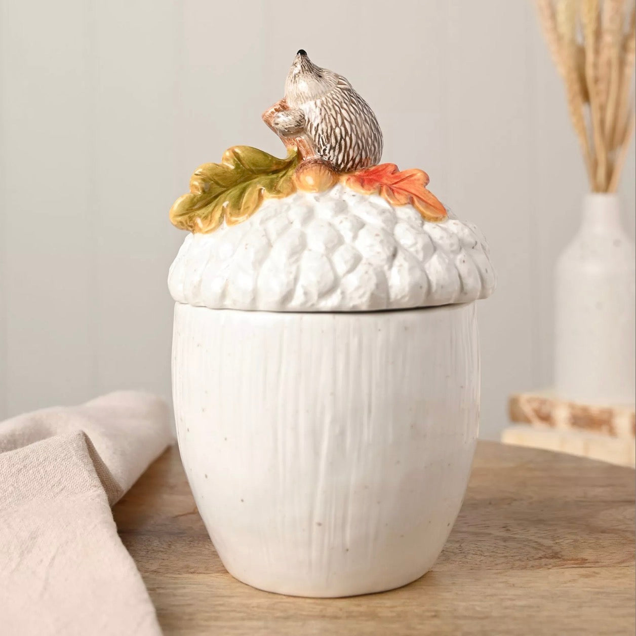Hedgehog on an acorn storage jar