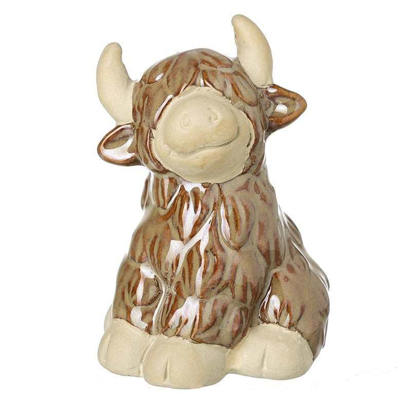 Ceramic sitting highland cow