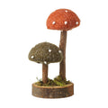 Little and large mushroom on log
