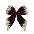 Purple velvet bow with gold trim