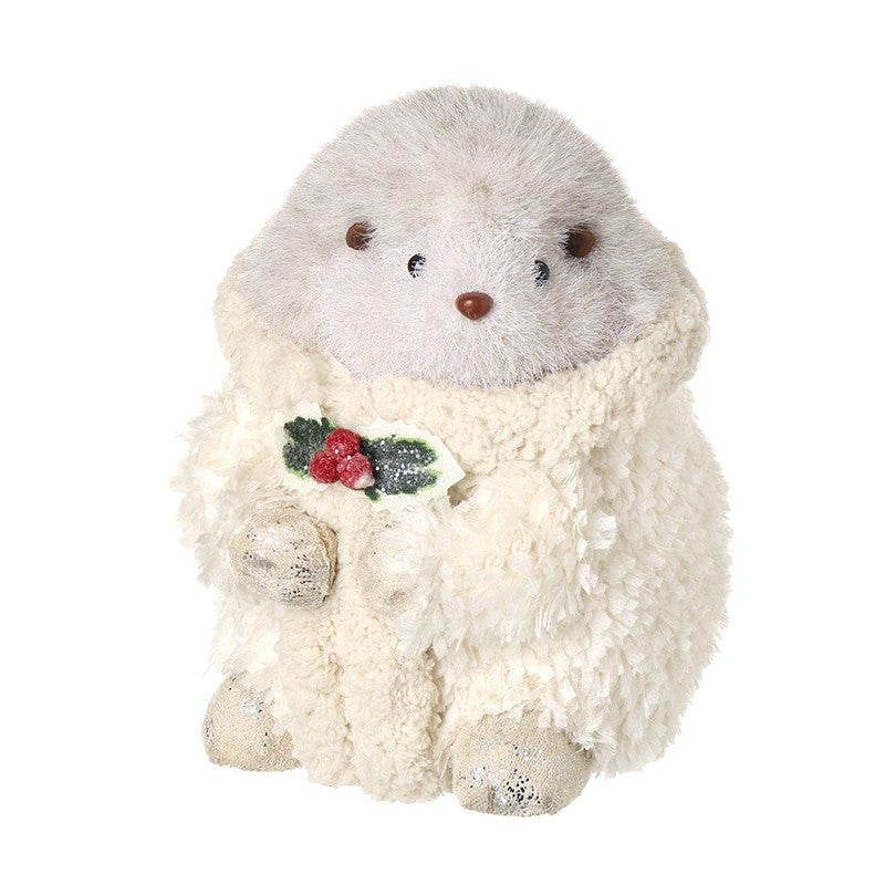 Small hedgehog in fluffy beige coat