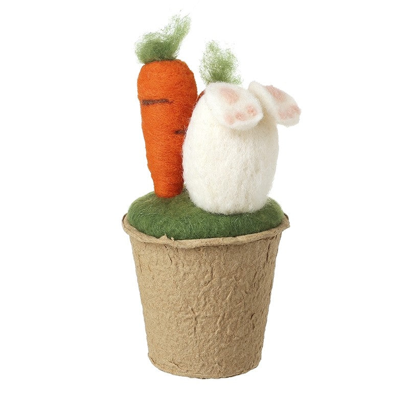 Felt rabbit feet and carrot in plant pot