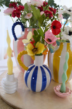 Blue & white stripe vase with yellow rope handle