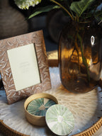 Round rattan tray with capiz detail