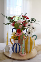 Blue & white stripe vase with yellow rope handle