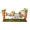 Rabbit in a carrot hammock
