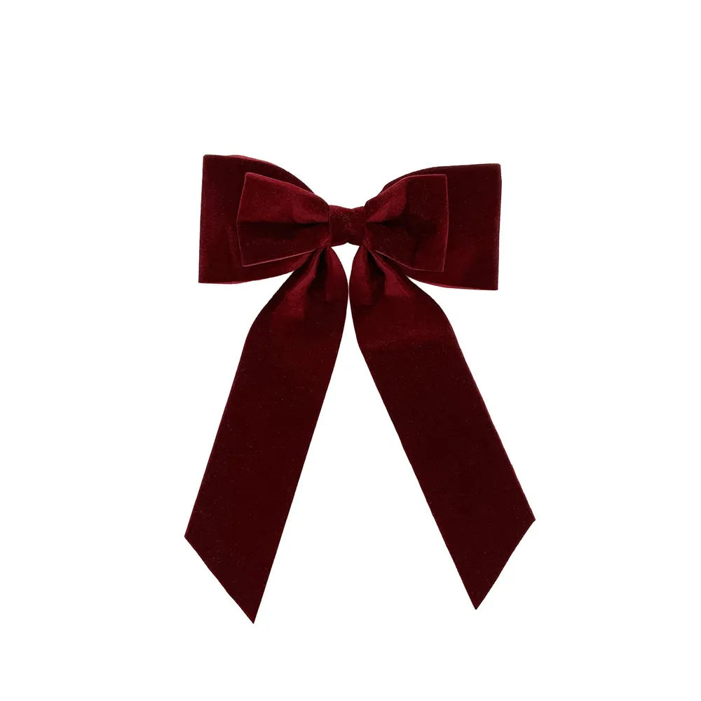 Burgundy velvet bow on clip