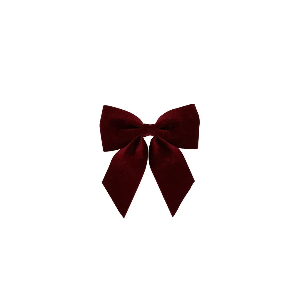 Burgundy velvet bow on a clip