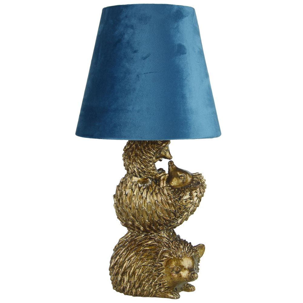 Gold hedgehog lamp with navy velvet shade