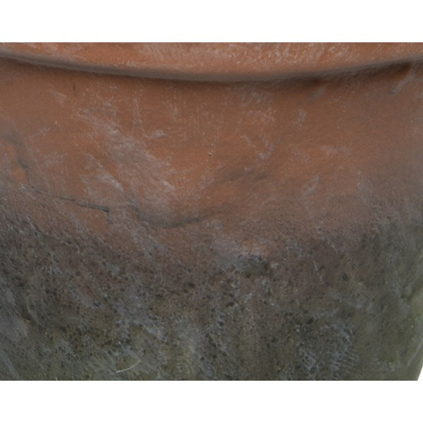 Faux plant in rustic pot