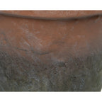 Faux plant in rustic pot