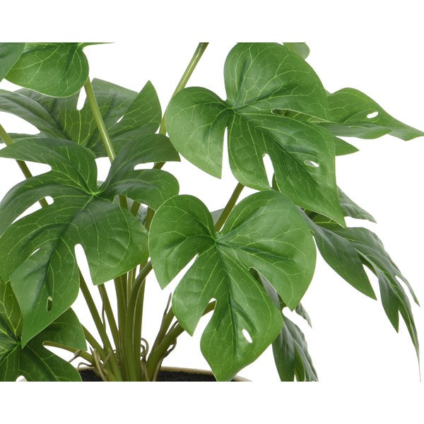 Faux plant in pot with feet