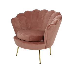 Dusky pink lounge chair with scalloped shell back