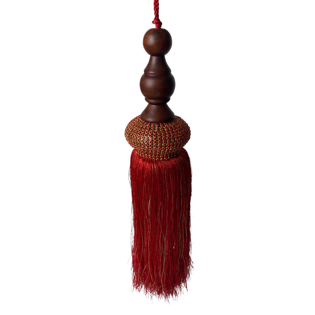 Large red and gold tassle with wooden top