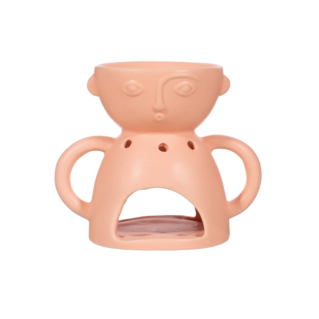 Abstract face styled oil burner in matte pink