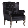 Black button back armchair