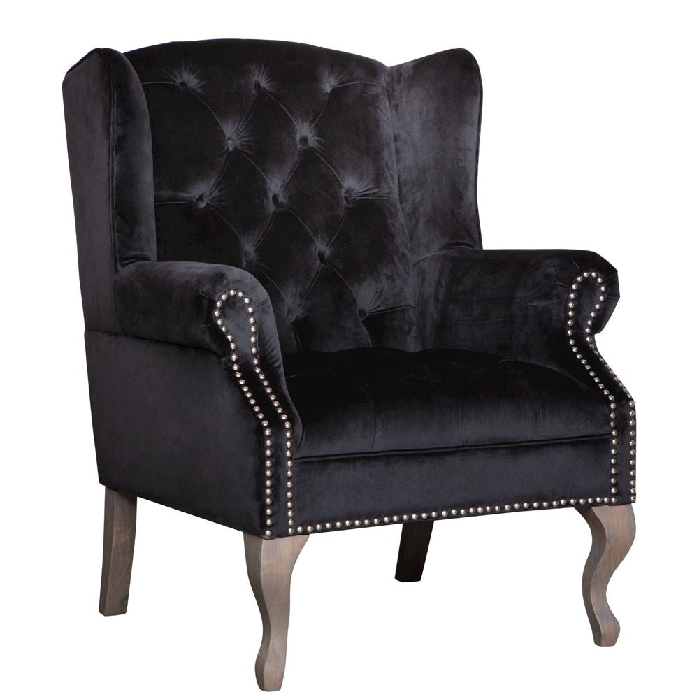 Black button back armchair